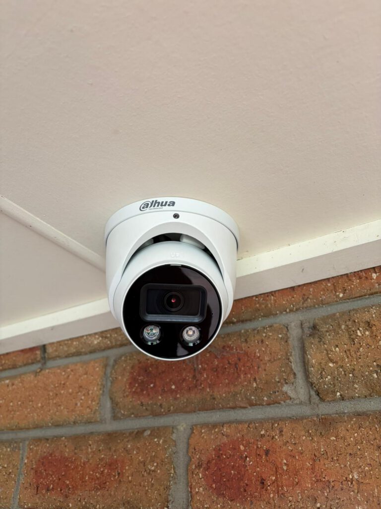 Dahua CCTV camera installed on the eaves of a house