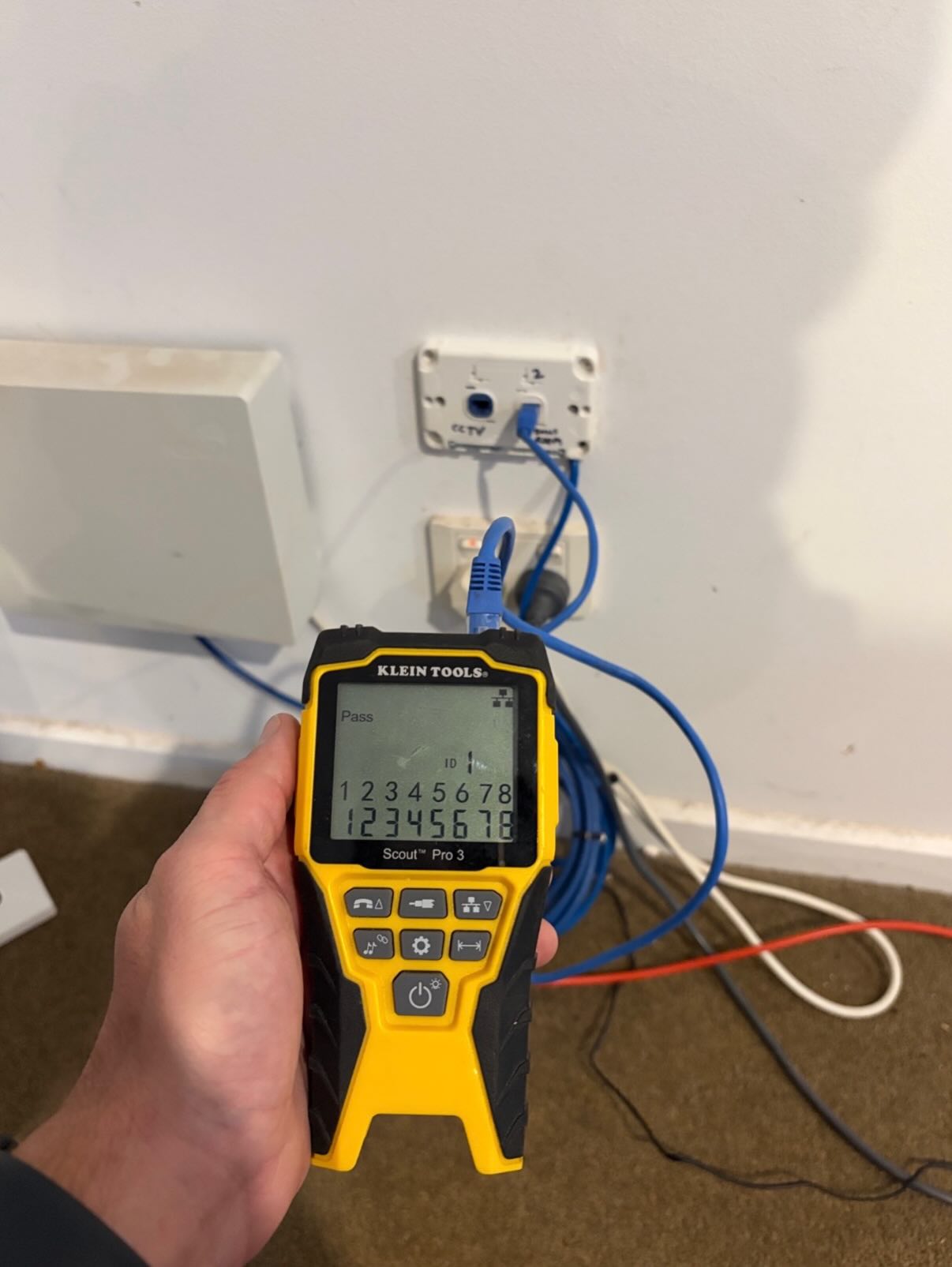 Klein Tools cable tester showing Pass on a Cat6 data point